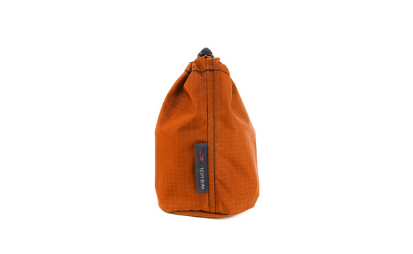 A Size 1 Persimmon (dark orange with orange grid) 210 Cerylon Travel Stuff Sack.